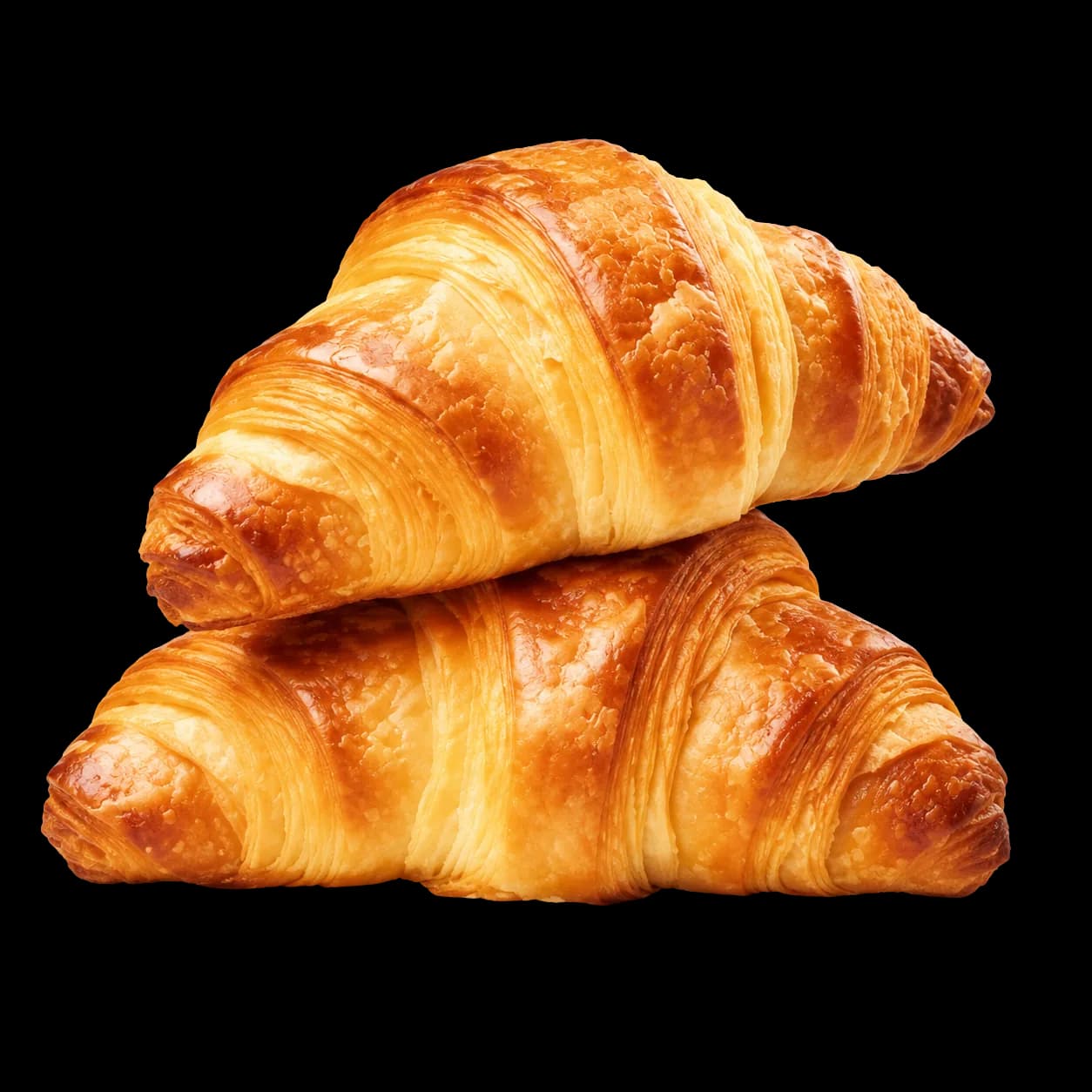 Two stacked golden croissants with visible laminated layers