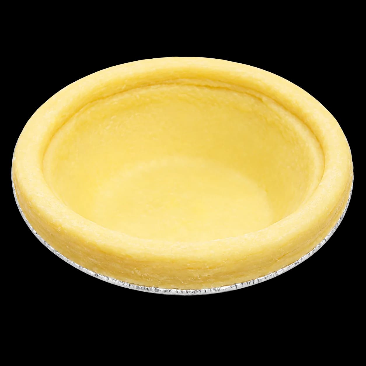 Single unbaked egg tart shell pressed into a round foil cup